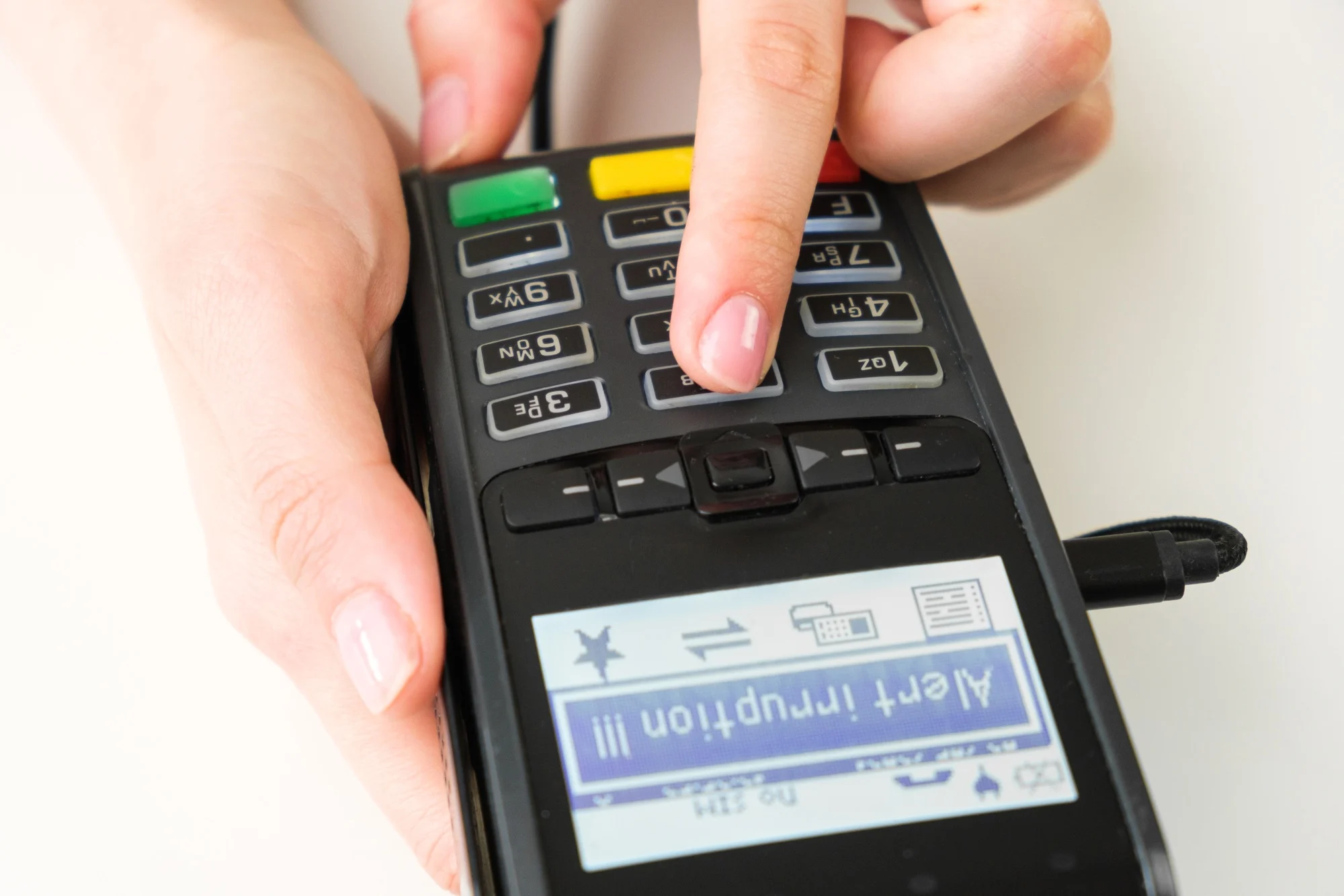 Alert irruption on the pos terminal in womans hand